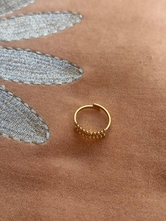 Stalen verstelbare ring met gestippelde rand - goud
