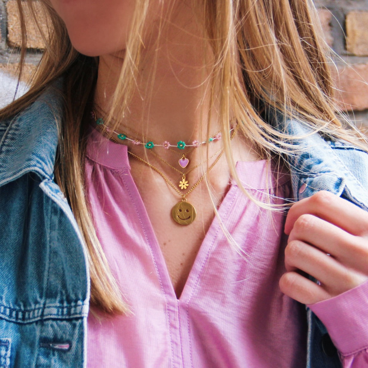 RVS fijne ketting met mini bloem - goud